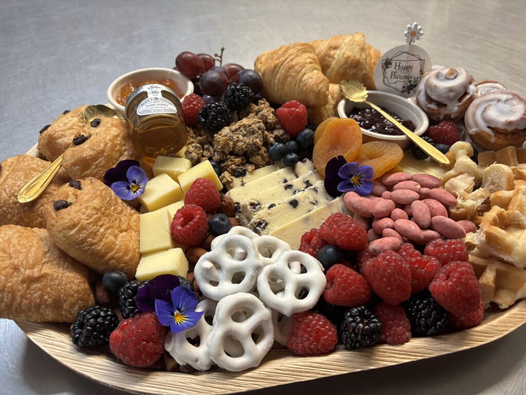 A gourmet charcuterie board featuring brunch food and various appetizers for a perfect dining experience.